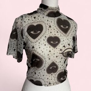 Sheer Black and White Heart Eye Mock Neck Top